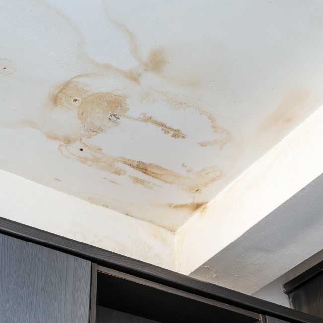 Water damaged ceiling in residential building that is in need of repair